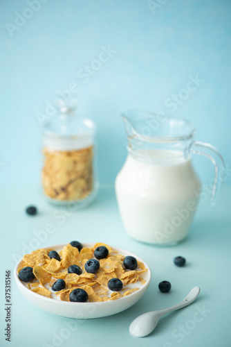 cornflakes with milk and blueberries