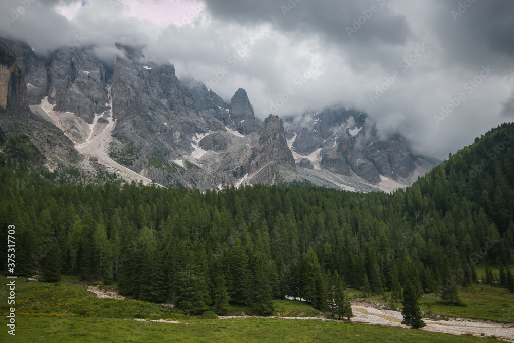 Panoramic view of Pale di San Martino from Val Venegia in Trentino during cloudy summer day, Italy