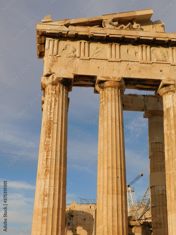 Corner columns and sculptures of the Parthenon, the ancient temple of goddess Athena, in Athens, Greece