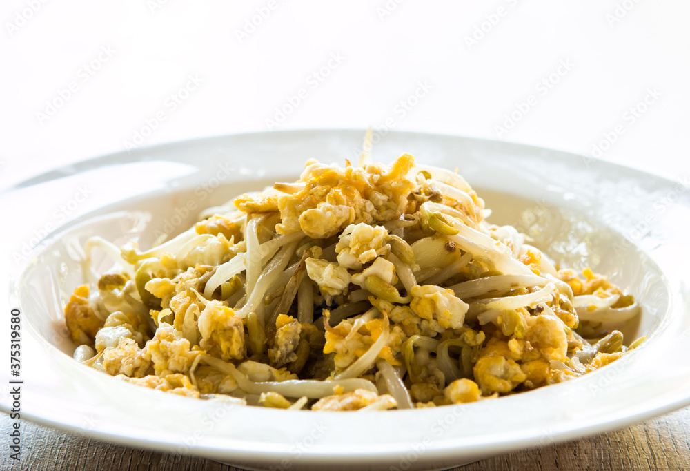 Fried bean sprouts with egg in plate, Thai food Fried bean sprouts with egg in plate, Thai food