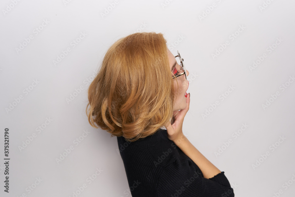 Cute blonde in glasses bright makeup black jacket cropped view light background emotions Cute blonde in glasses bright makeup black jacket cropped view light background emotions