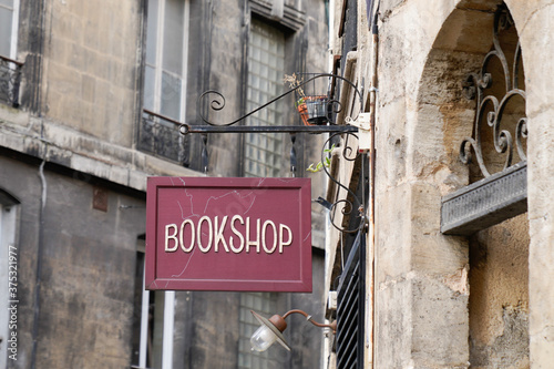 bookshop sign on steel plate vintage signage of bookstore in city street in ancient european city
