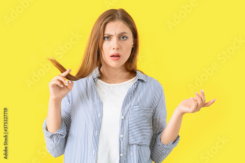 Stressed woman with hair pr...