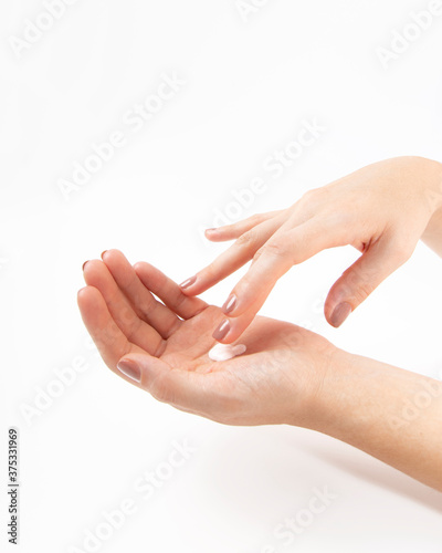 Woman hands applying cream. Medical or beauty treatment