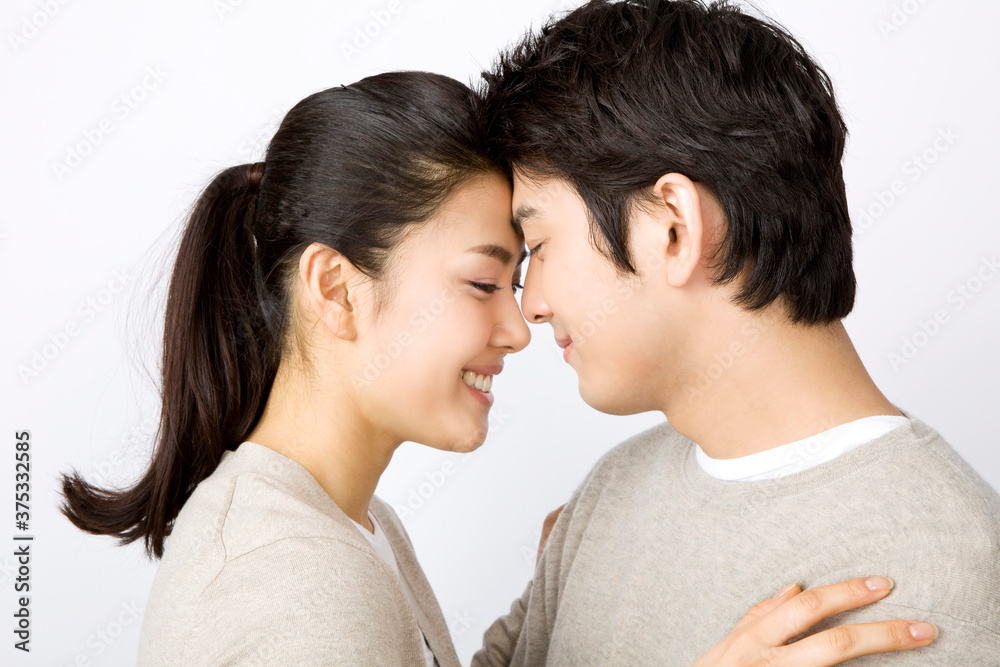 young couple facing each other young couple facing each other