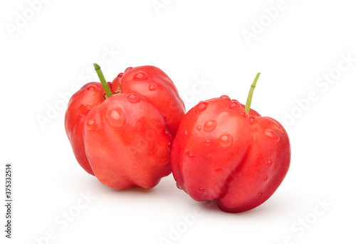 Organic acerola cherry with water droplets isolated on white background. Clipping path.