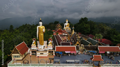 Photography What Phra That Doi Kham literally means Temple of the Golden Mountain, this temple is situated on Doi Kham hill, surrounded by beautiful jungle covered mountains in Chiang Mai