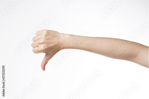 a woman's hand with her thumb down.