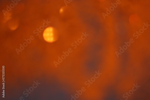 Bokeh orange slightly brown abstract background