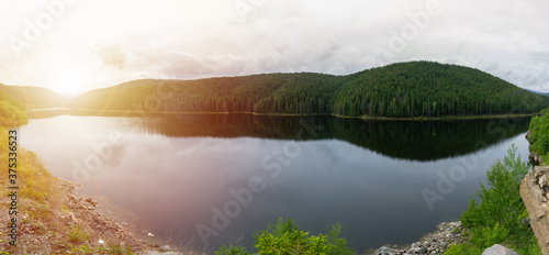 Oasa Lake, Transalpina, Romania. Panorama of beautiful lake seen from the Transalpina road. photo