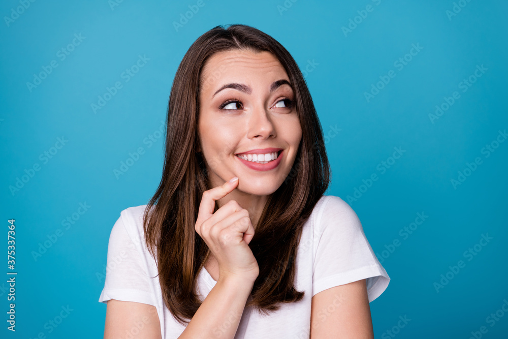 Closeup photo of attractive funny lady good mood charming appearance look side empty space made stupid thing girlish expression wear casual white t-shirt isolated blue color background Closeup photo of attractive funny lady good mood charming appearance look side empty space made stupid thing girlish expression wear casual white t-shirt isolated blue color background