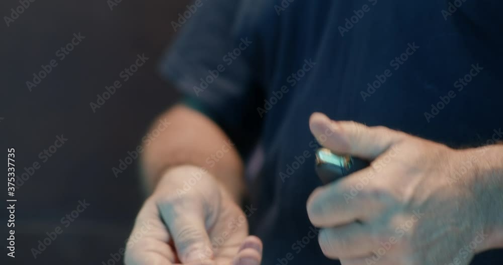 Crop shooter putting ammo into magazine Crop shooter putting ammo into magazine