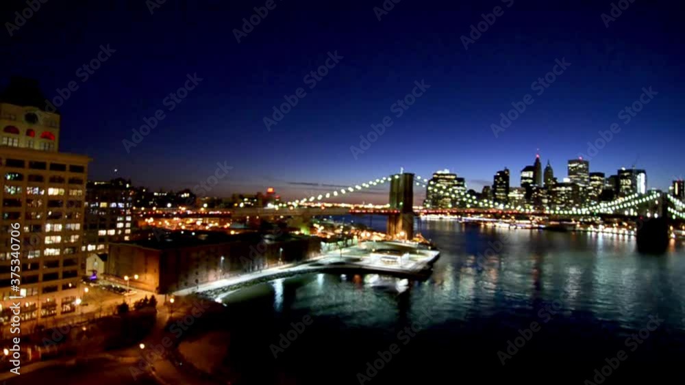 Brooklyn Bridge and Manhattan skyline at dusk from Manhattan Bridge. Slow motion Brooklyn Bridge and Manhattan skyline at dusk from Manhattan Bridge. Slow motion