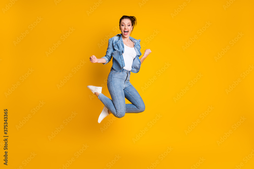 Full length body size view of her she attractive glad cheerful cheery funky girl jumping rejoicing having fun great news isolated bright vivid shine vibrant yellow color background