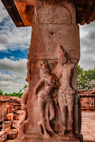 sculptures of hindu gods on facade of 7th century temple carved walls in Pattadakal photo