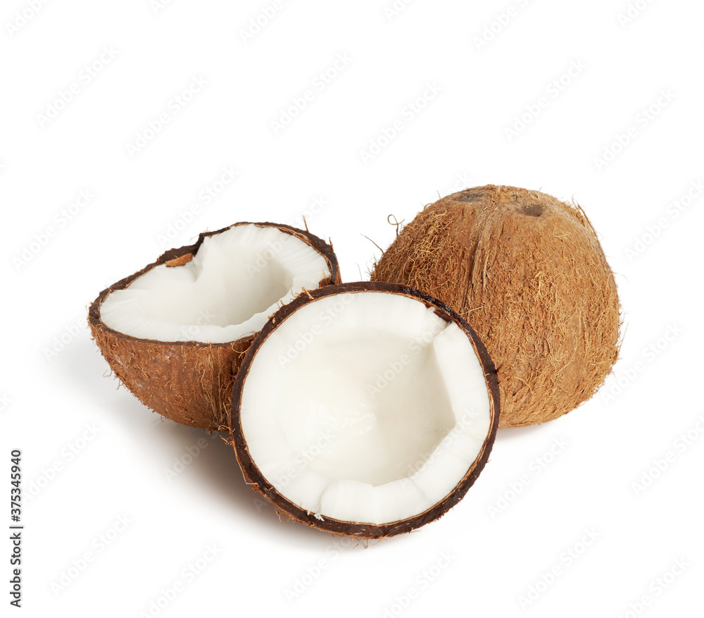 whole round and split in half ripe coconut isolated on white background