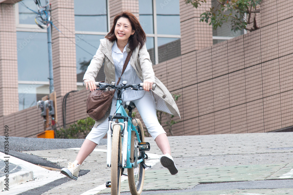 Fotografie 自転車に乗る女性