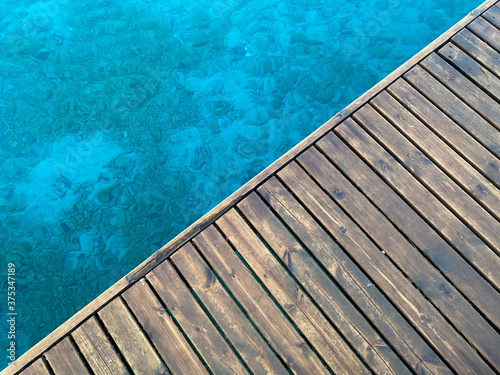 close up wooden floor on the sea © bahadirbermekphoto