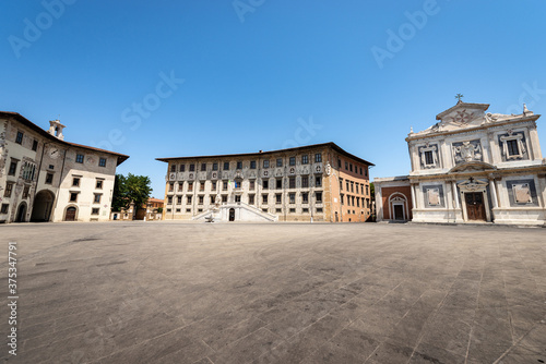 Pisa, Square of the Knights (Piazza dei Cavalieri) with the building of the University (Palazzo della Carovana, Scuola Normale Superiore) and the church of Santo Stefano dei Cavalieri. Tuscany, Italy