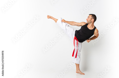 karateka practicing kata with white background