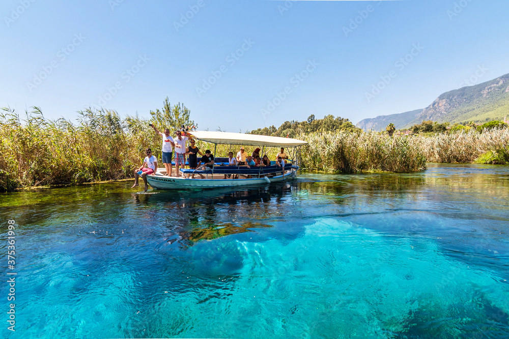 Taking tour on Azmak Stream in Akyaka Village. Akyaka is popular tourist destination in Turkey. Taking tour on Azmak Stream in Akyaka Village. Akyaka is popular tourist destination in Turkey.