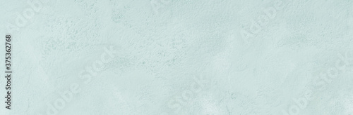 Pastel turquoise textured painted concrete background. Abstract design web banner backdrop