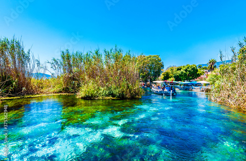 Taking tour on Azmak Stream in Akyaka Village. Akyaka is popular tourist destination in Turkey.