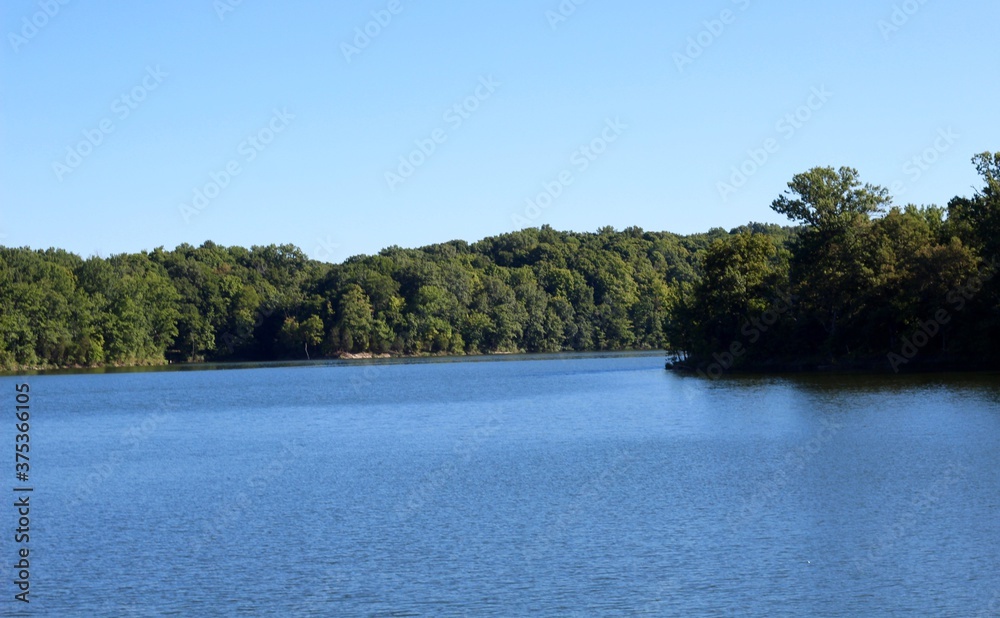 A beautiful peaceful view of the lake in the countryside. A beautiful peaceful view of the lake in the countryside.