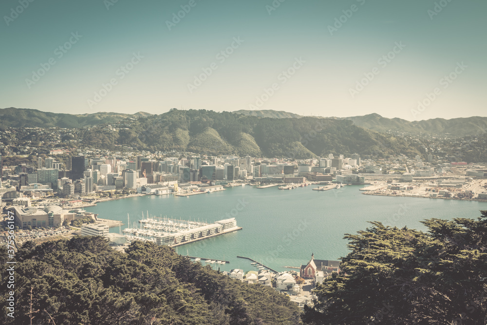 Vintage photo of Wellington Harbour and Central Business District on a bright summer day.