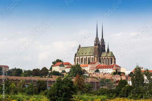Brno - Petrov, view of the church of St. Peter and Paul, standing on a hill above the city. Around Petrov there are burgher houses and below it terraced gardens and trees.