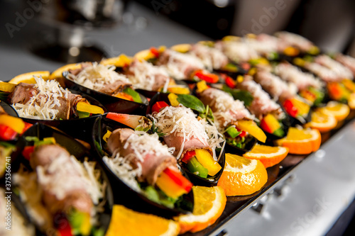 canapes of rolled meat with vegetables
