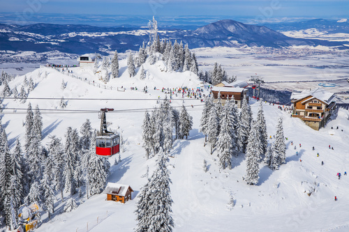 Poiana Brasov, Romania.  Panoramic view over the ski slopes with cable car.