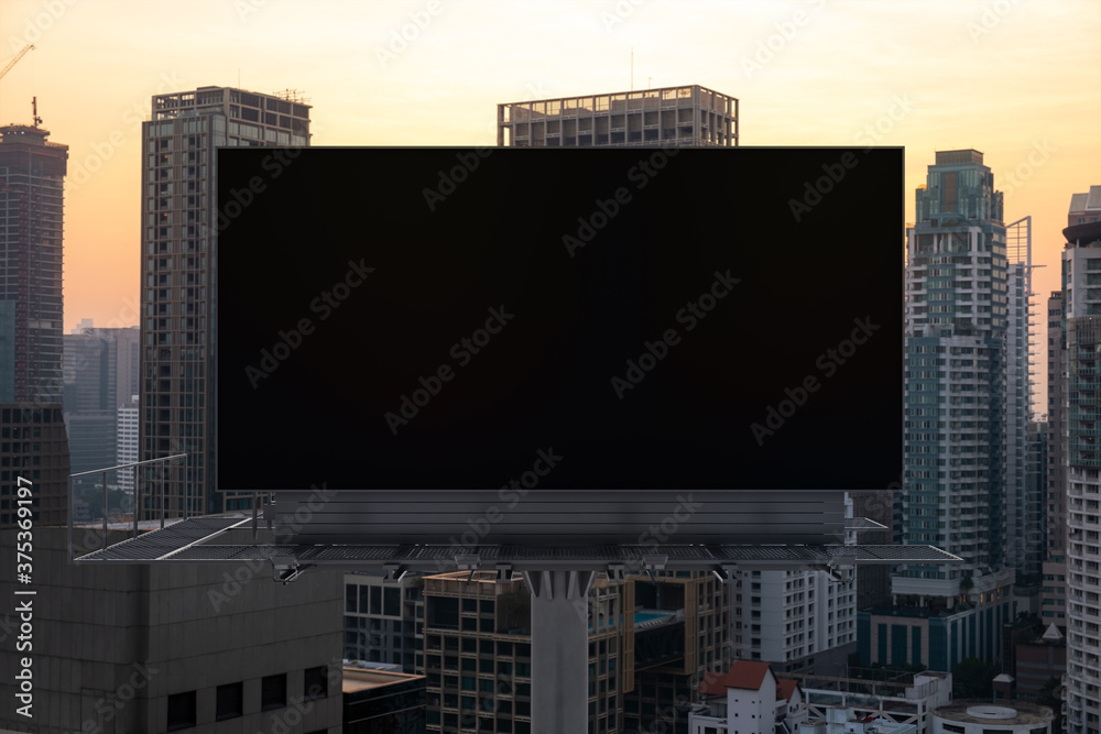 Blank black road billboard with Bangkok cityscape background at sunset. Street advertising poster, mock up, 3D rendering. Front view. The concept of marketing communication to promote or sell idea. Blank black road billboard with Bangkok cityscape background at sunset. Street advertising poster, mock up, 3D rendering. Front view. The concept of marketing communication to promote or sell idea.