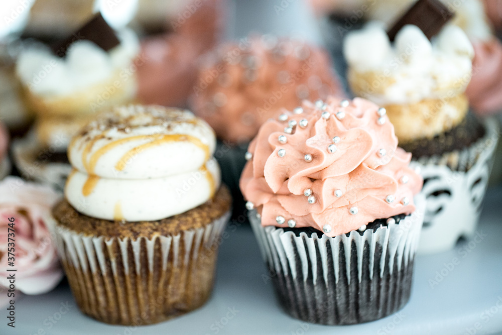 close up of elegant cupcakes on table for event close up of elegant cupcakes on table for event