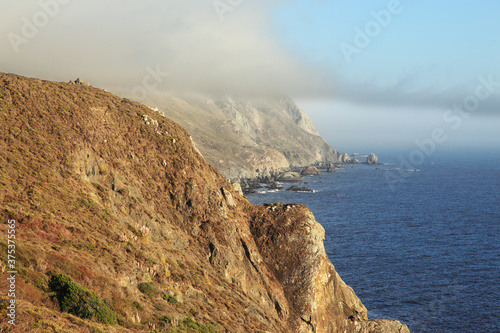 Coast of Pacific ocean and morning fog