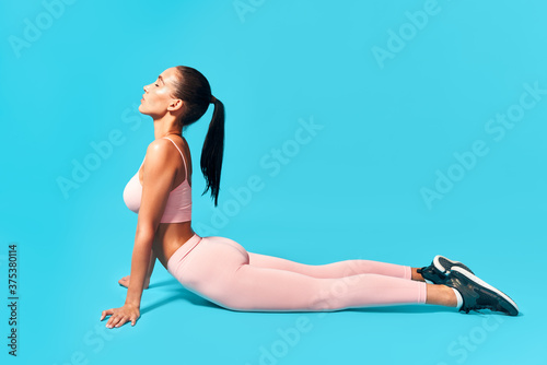 Fitness woman doing exercise cobra