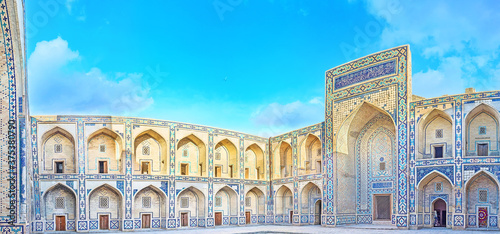The courtyard with tiled decoration of  Ulughbek Madrassah in Bukhara, Uzbekistan photo