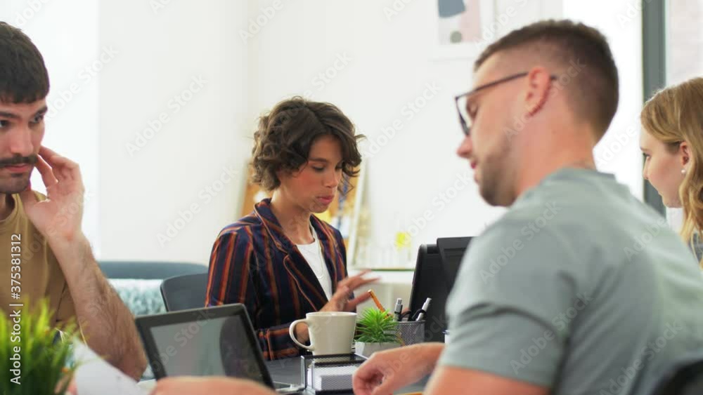 business, people and corporate concept - team of startuppers or ui designers working at office business, people and corporate concept - team of startuppers or ui designers working at office