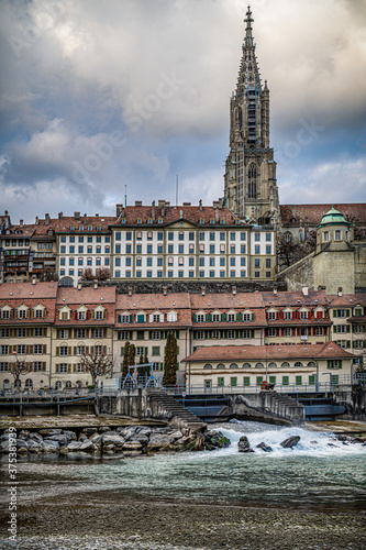 Minster of Bern in the down town rises above the Aare river