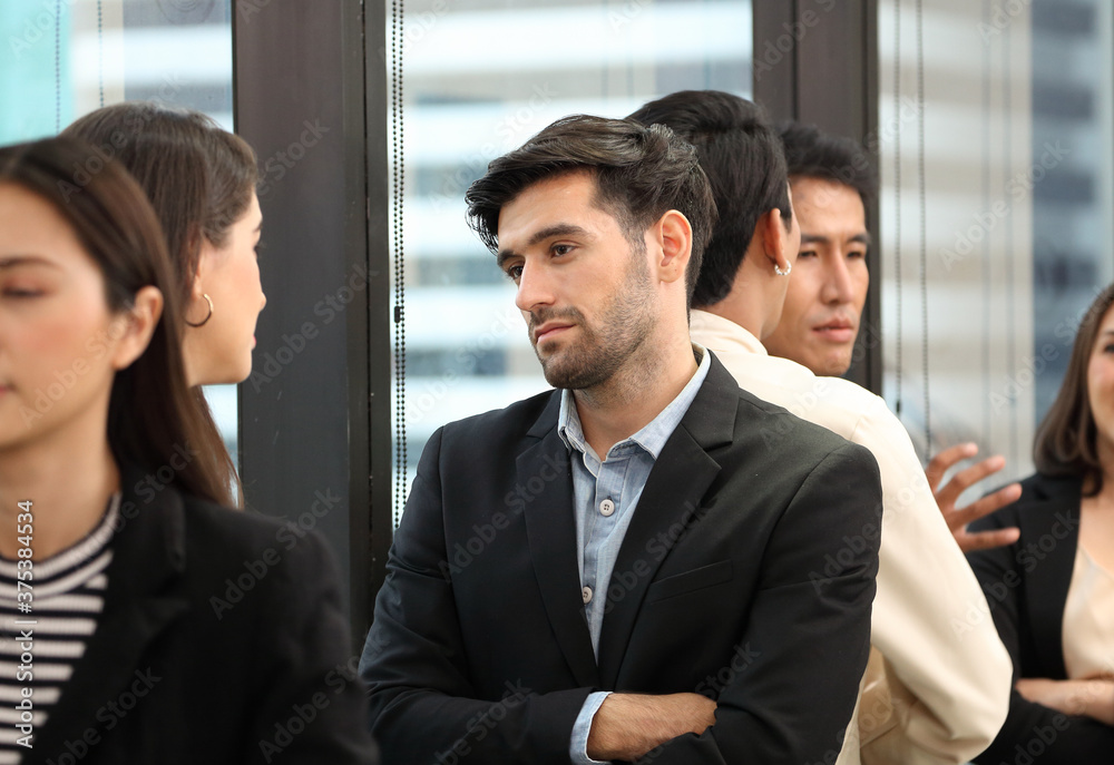 Serious executive team meeting for business new marketing strategy with diversity of employees from different ethnicity in modern office Serious executive team meeting for business new marketing strategy with diversity of employees from different ethnicity in modern office