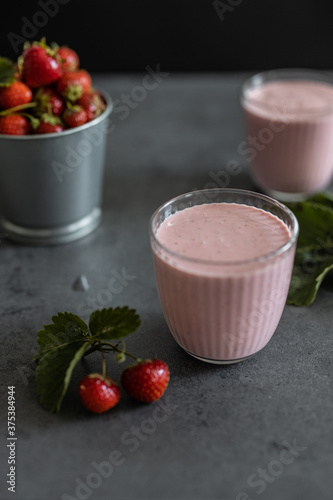 Two glasses of strawberry smoothie. Strawberry milkshake