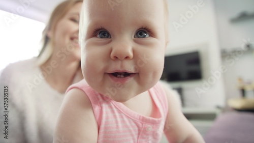 Happy baby portrait. Curious child exploring the world. Little baby smile
