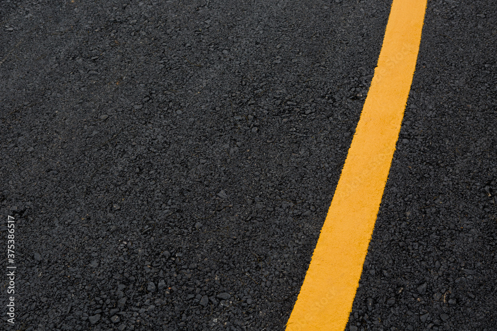 Fototapeta premium asphalt road with yellow lines