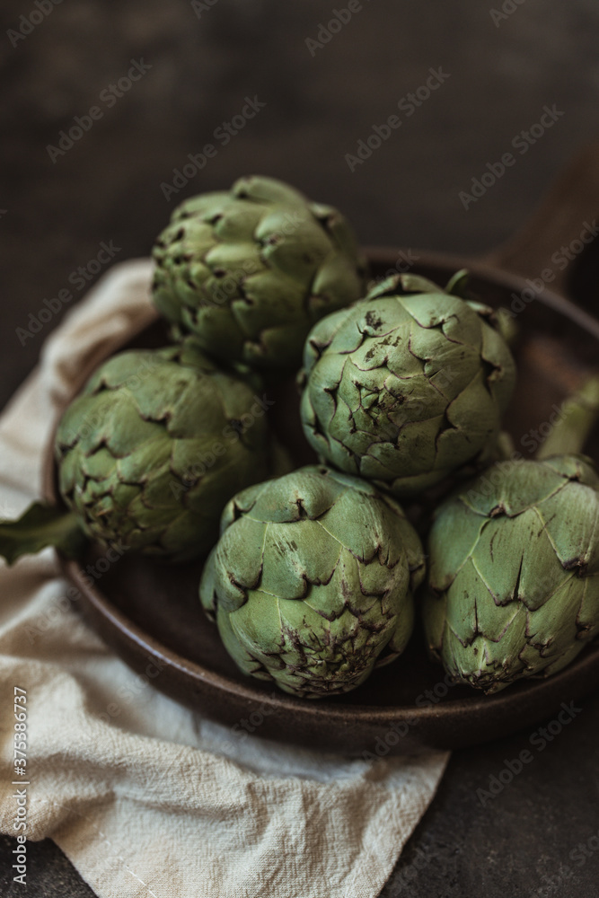 Fototapeta premium Fresh green artichokes. Top view. Copy space
