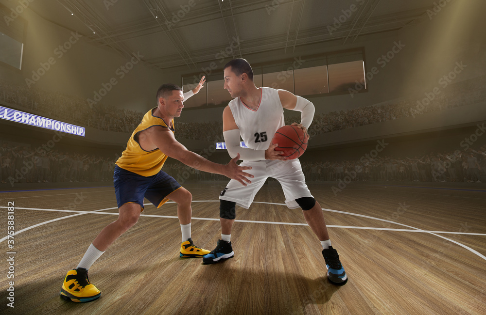 Fototapeta premium Basketball players on big professional arena during the game.