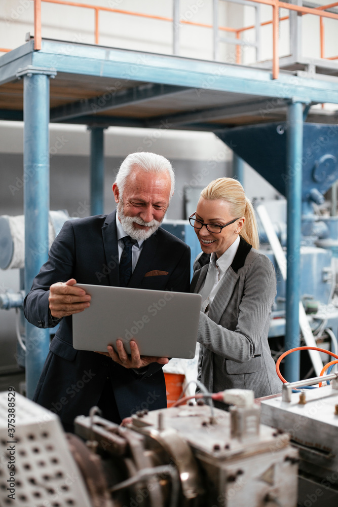 Man and woman discussing work. Colleagues working in factory... Man and woman discussing work. Colleagues working in factory...