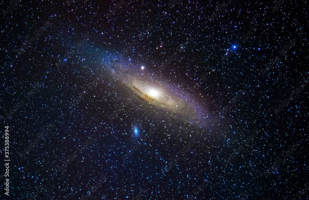 Naklejka Andromeda Galaxy M31. Stars and space dust in the universe. Astronomical background, deep space.
