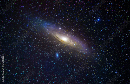 Andromeda Galaxy M31. Stars and space dust in the universe. Astronomical background, deep space.