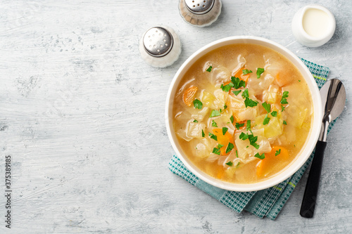 Homemade cabbage soup in bowl on concrete background Fototapeta