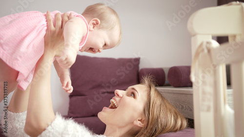 Happy mom with child. Mother enjoy baby laughing